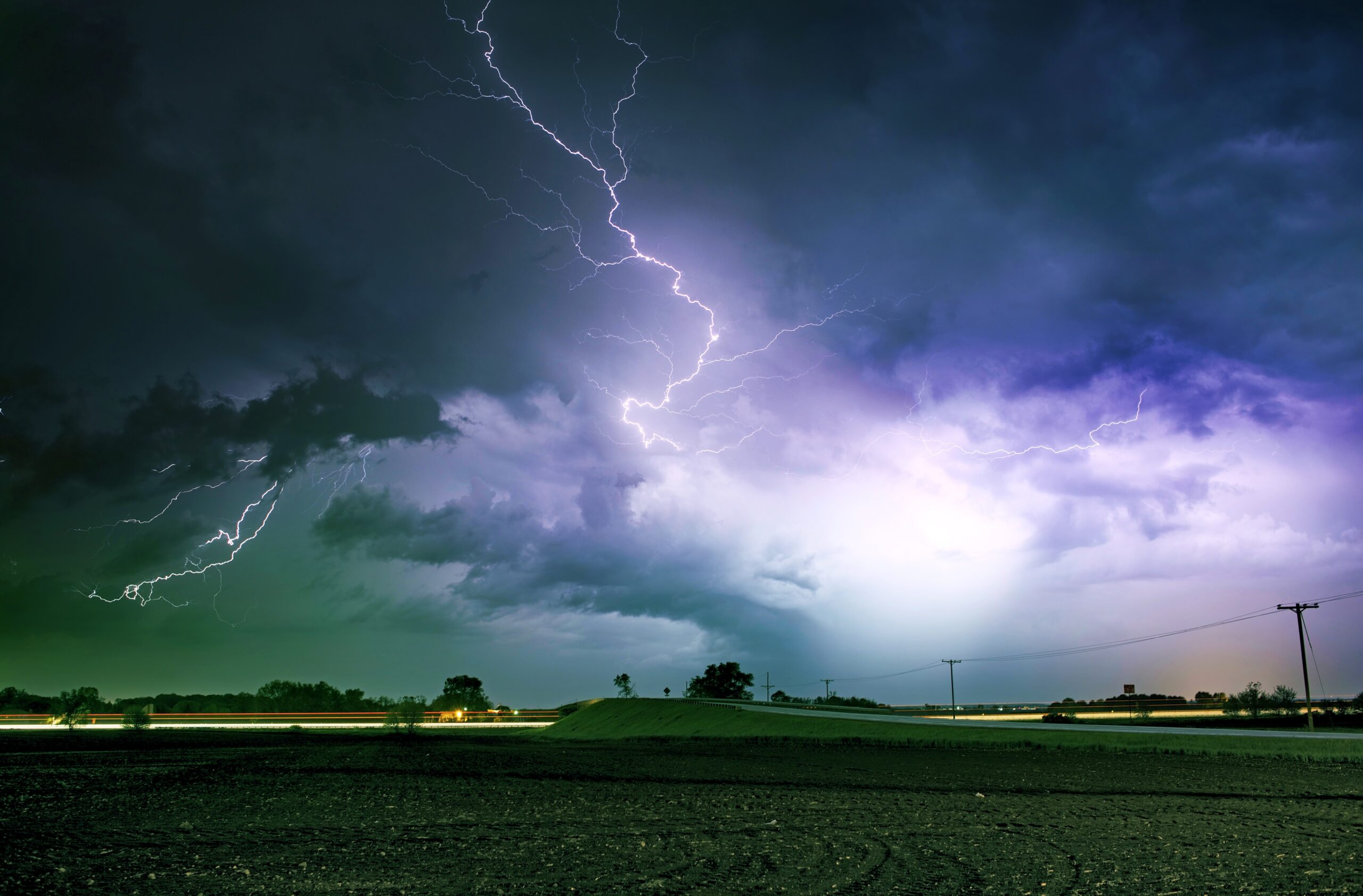 Tornado Alley Severe Storm at Night Time. Severe Lightnings Above Farmlands in Illinois, USA. Severe Weather Photography Collection.